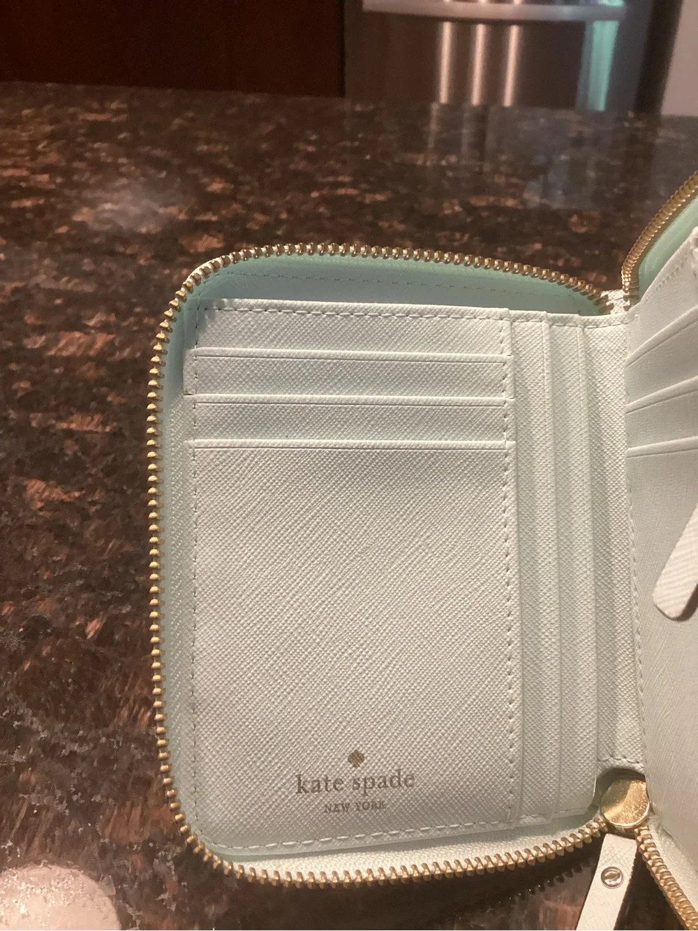 kate spade pale blue small flap wallet with gold plaque